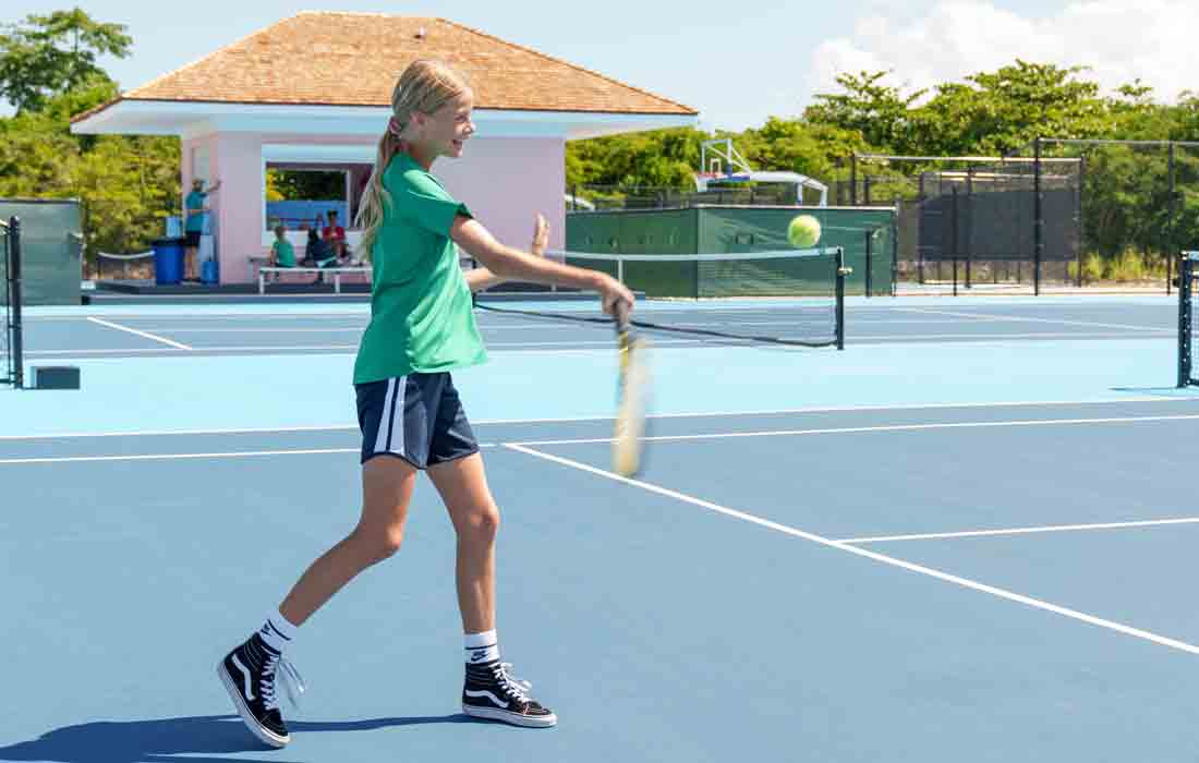 Girl playing tennis.